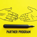 Yellow background, marker, partner program, handshake