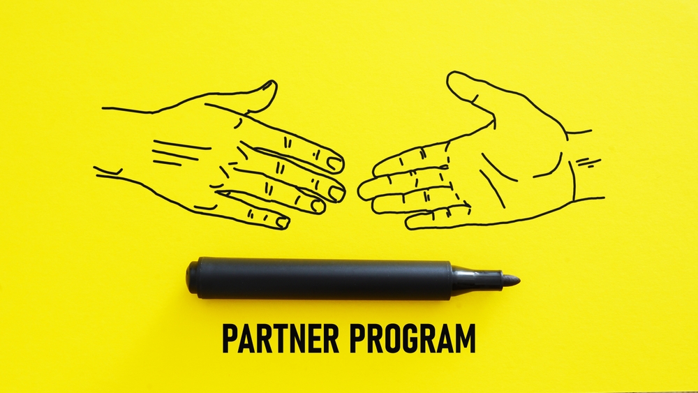 Yellow background, marker, partner program, handshake